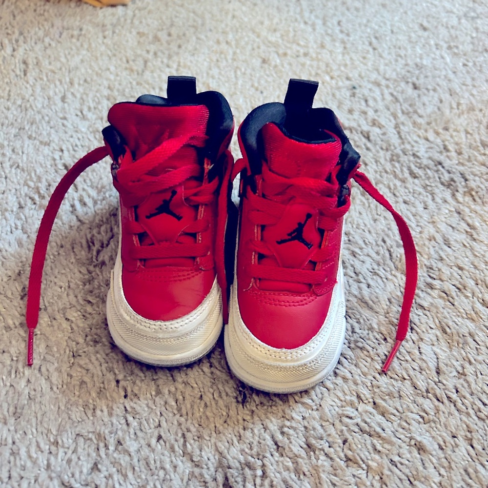 Kids red Jordan Spizikes.